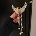 Pearl Winged Metal Clutcher Pearl Winged Metal Clutcher