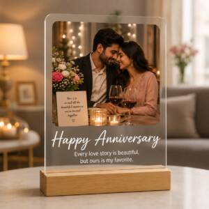 Anniversary acrylic photo frame with example photograph and wording on its pinewood stand