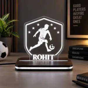 Personalised football acrylic LED trophy on an illuminated base, with a sample name